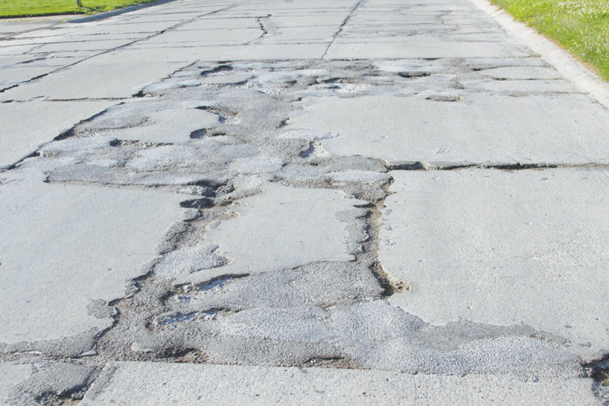  This photo shows a particularly rough section of Commerce Road in the Fraser Industrial Park. The city has supported using $3.5 million toward the project with $4 million in state funds. 