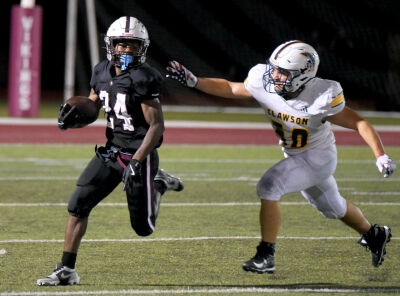  Hazel Park junior Montrell Parker carries the ball during a matchup against Clawson on Sept. 20 at Hazel Park High School. 