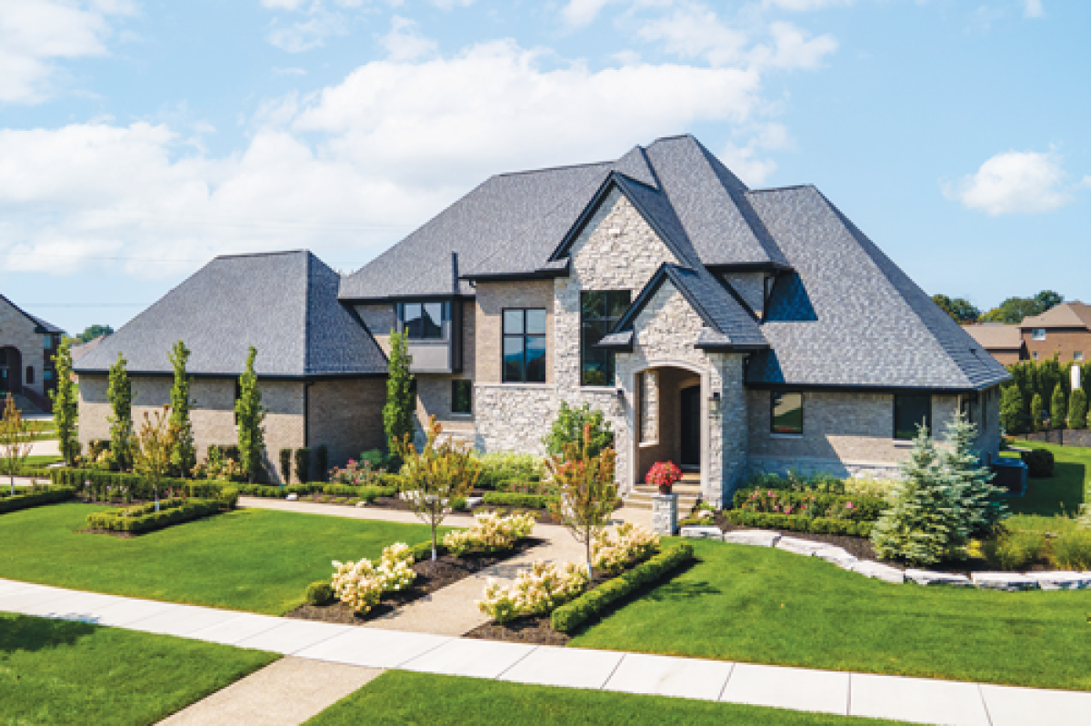  Jennifer Tommajin, of Real Estate One in Troy, designed this  home that showcases the amount of space and functionality a  multigenerational home could use. The 6,938-square-foot home  includes five bedrooms, four full baths, and one half bath.  