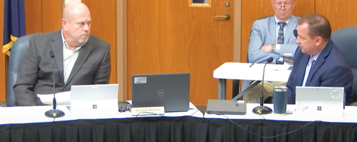  Clinton Township Trustee Dan Kress, right, questions Treasurer Paul Gieleghem about property taxes at the Board of Trustees meeting on Sept. 9. 