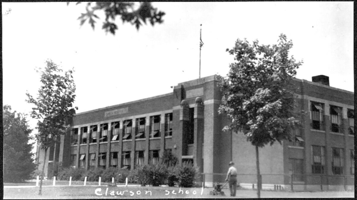  This photo was taken in 1924 and shows the original Clawson High School. The windows are all open, likely because the school had no air conditioning and it was a hot day. 