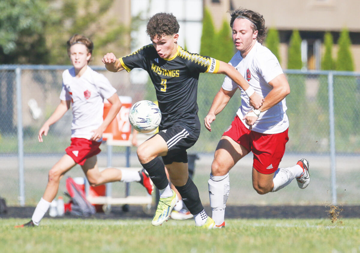  Macomb Lutheran North sophomore Julian Gibbs controls the ball during a game against Dearborn Divine Child on Sept. 21 at Lutheran North High School. 