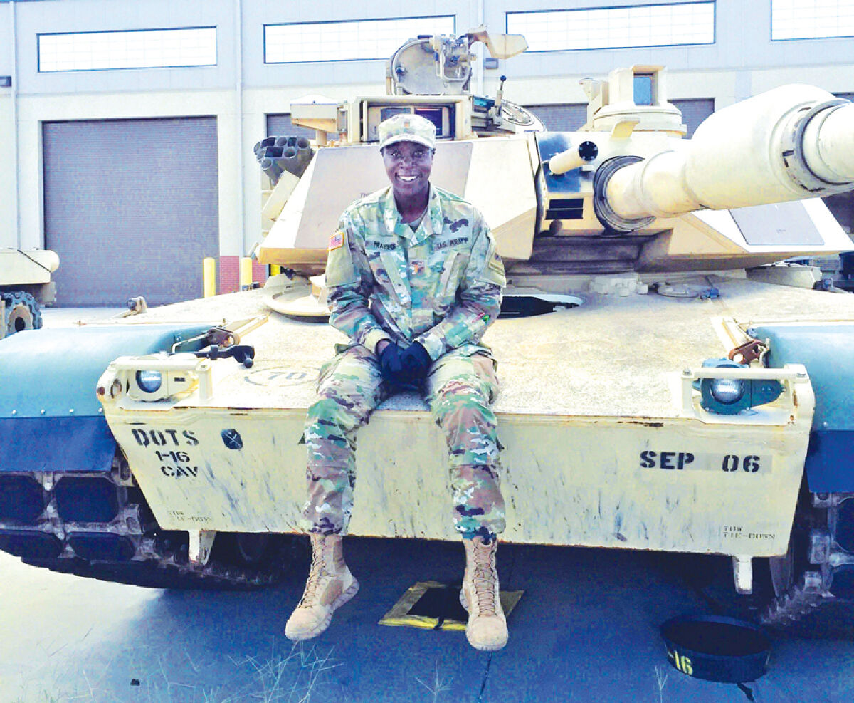  Gen. Douglas MacArthur Award winner Capt. Anna Jones (then a 1st Lt.) on a M1A2 SEP V2 Abrams tank while attending the Armor Basic Officer Leadership Course at Fort Benning, Georgia. 