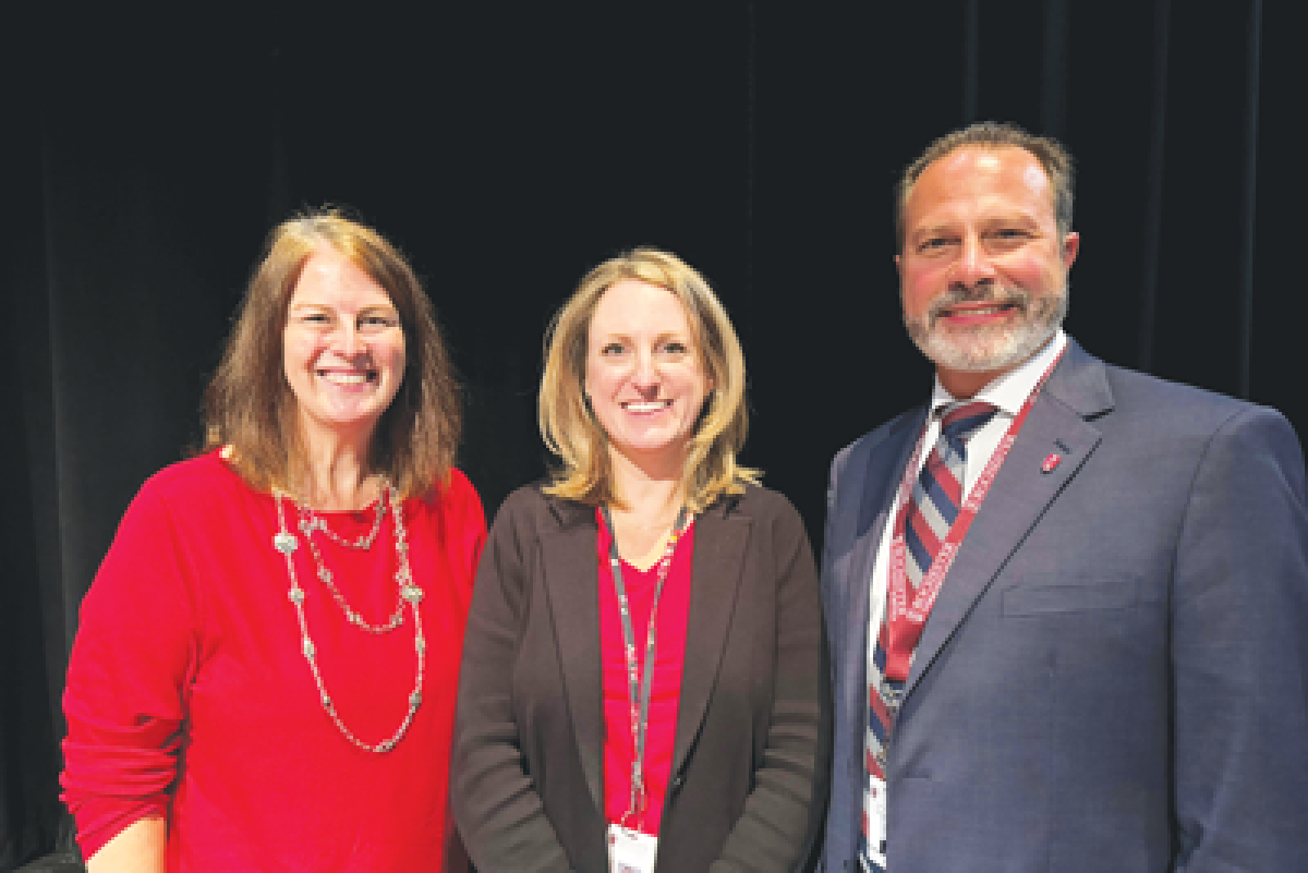  RCS Board of Education President Michelle Bueltel, REA President Elizabeth Schroeck and Superintendent Nicholas Russo were all smiles after the board approved an agreement with the district’s teachers union. 