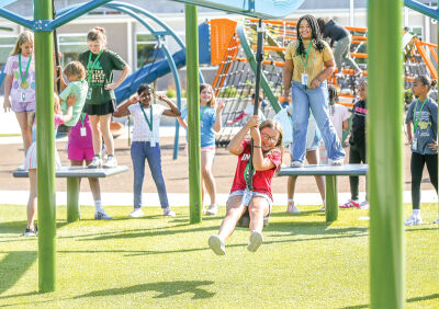  Students enjoy the new playground at Novi Meadows, and the zip line is especially popular. 