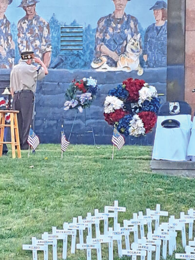  A veteran salutes a wreath presented in honor of prisoners of war and those missing in action at the “Michigan Remembers” POW/MIA Memorial at Oakland Hills Memorial Gardens on National POW/MIA Recognition Day, Sept. 20. 