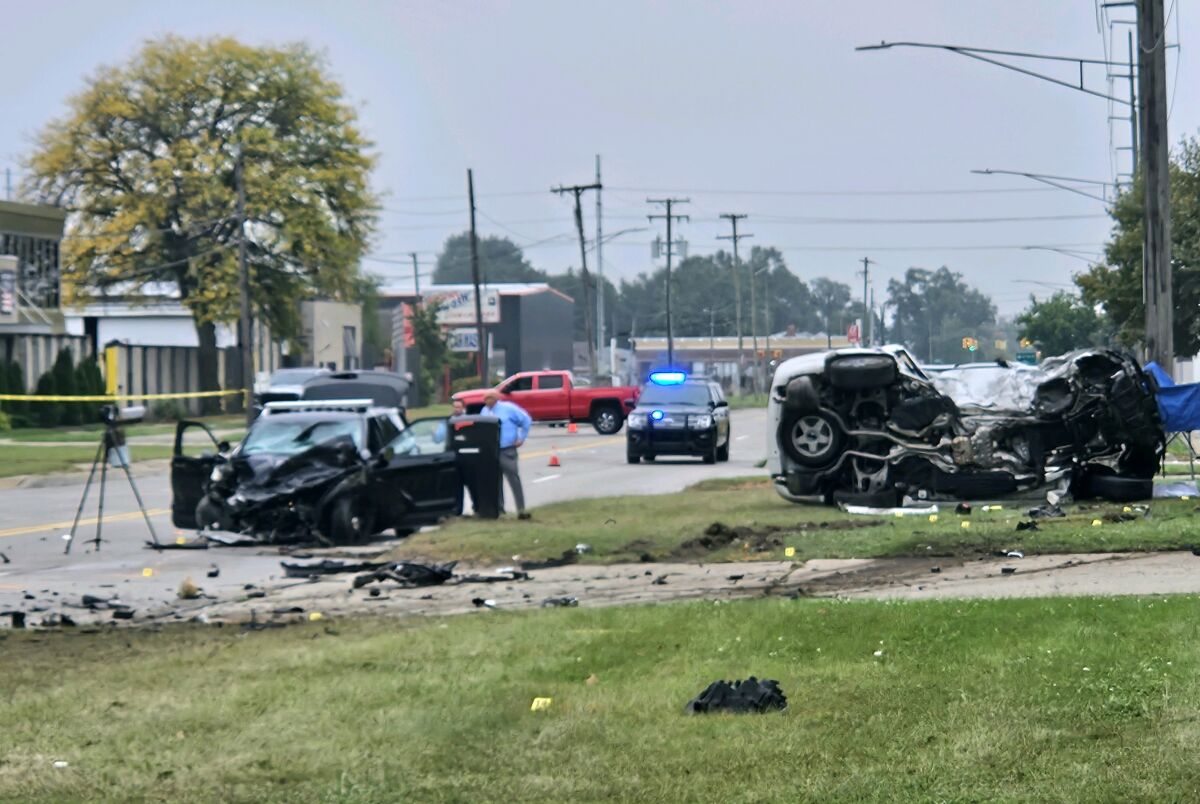  Two Warren police officers in a marked patrol car were going southbound on Schoenherr Road toward Prospect Avenue when they were involved in a crash with a white Dodge Durango at approximately 5 a.m. on Sept. 30.  