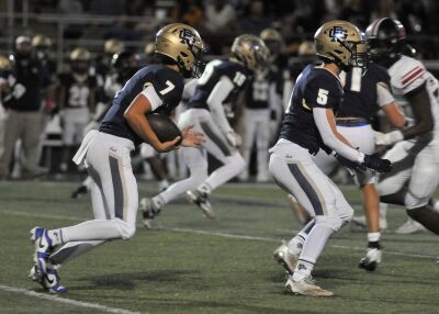  Grosse Pointe South senior quarterback Jack Lupo carries the ball.  