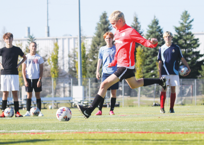  Bloomfield Hills Roeper sophomore Henry Billings attempts a penalty kick during a team practice. 