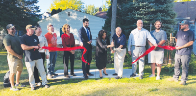  Grosse Pointe Woods officials and donors cut the ribbon on the new Ahee Jewelers Disc Golf Course at Ghesquiere Park Oct. 2. The park is adjacent to the Woods City Hall parking lot. 