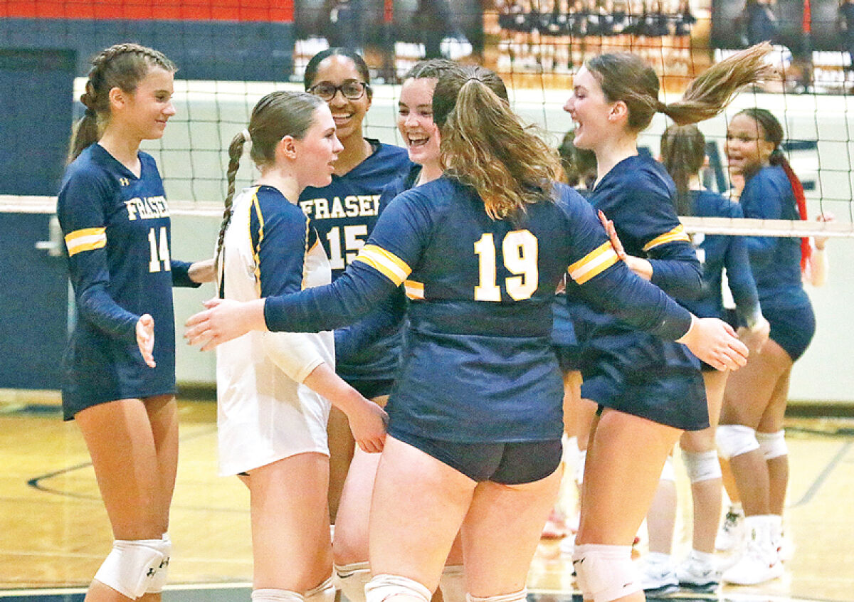  Fraser volleyball celebrates a point during a matchup against Sterling Heights Stevenson on Oct. 3 at Stevenson High School. 