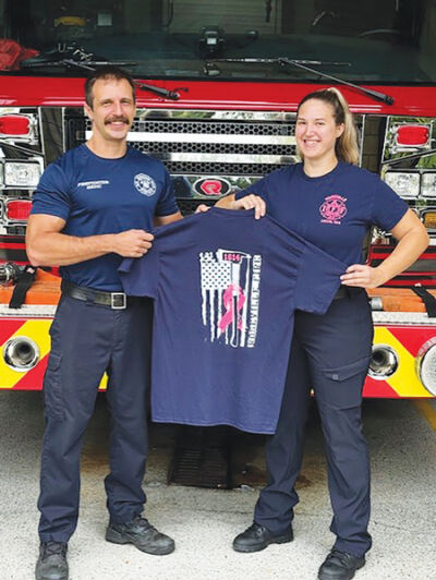  The Roseville Fire Department is selling breast cancer awareness T-shirts for $20 each this month. The firefighters, including Kyle Branchick, left, and Jessica Krali will wear them throughout October in honor of Breast Cancer Awareness Month. Proceeds from T-shirt sales will benefit members of the community. 