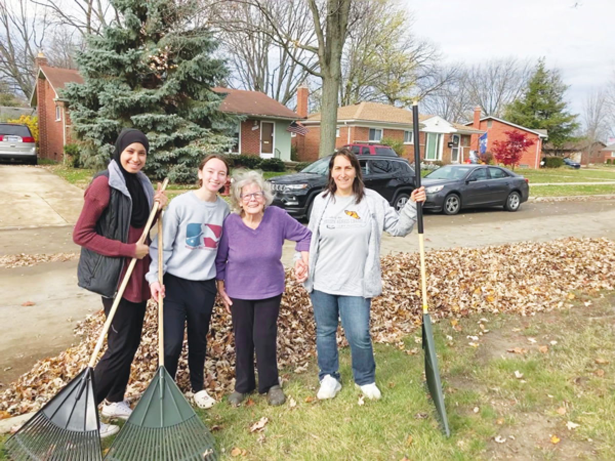  Madison Heights Mayor Roslyn Grafstein, far right, shares a moment with two Lamphere High School  students and a senior whose yard they helped tidy up during the Rake with the Mayor event in 2022.  Volunteers for this year’s event will meet at 9 a.m. Saturday, Oct. 26, at the Active Adult Center,  located at 260 W. 13 Mile Road. All are invited.  