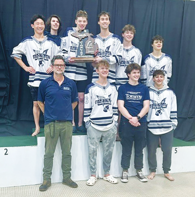  Farmington boys swim and dive head coach Drew Hansz stands with his team at the Division 2 state finals March 9 at Eastern Michigan University. 