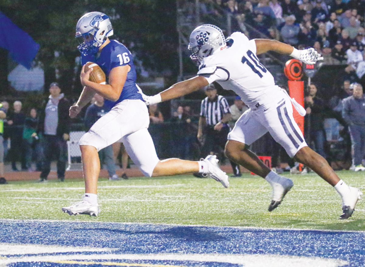  Utica Eisenhower senior quarterback Jack Bullock scores off a 20-yard flea-flicker pass from junior wideout Braylon Burnside. 