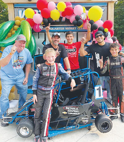  Bryce Koerner celebrates winning the Midwest Thunder 2024 formula modified championship at Kokomo Quarter Midget Club in Kokomo, Indiana. Bryce is joined, from left, by his grandpa and tire guy Mike Lachat, dad and crew chief Nick Koerner, driver trainer Jackson Diehl, owner of BRE Racing Engines Javin Mendoza and fellow competitor Ellis Mendoza. 