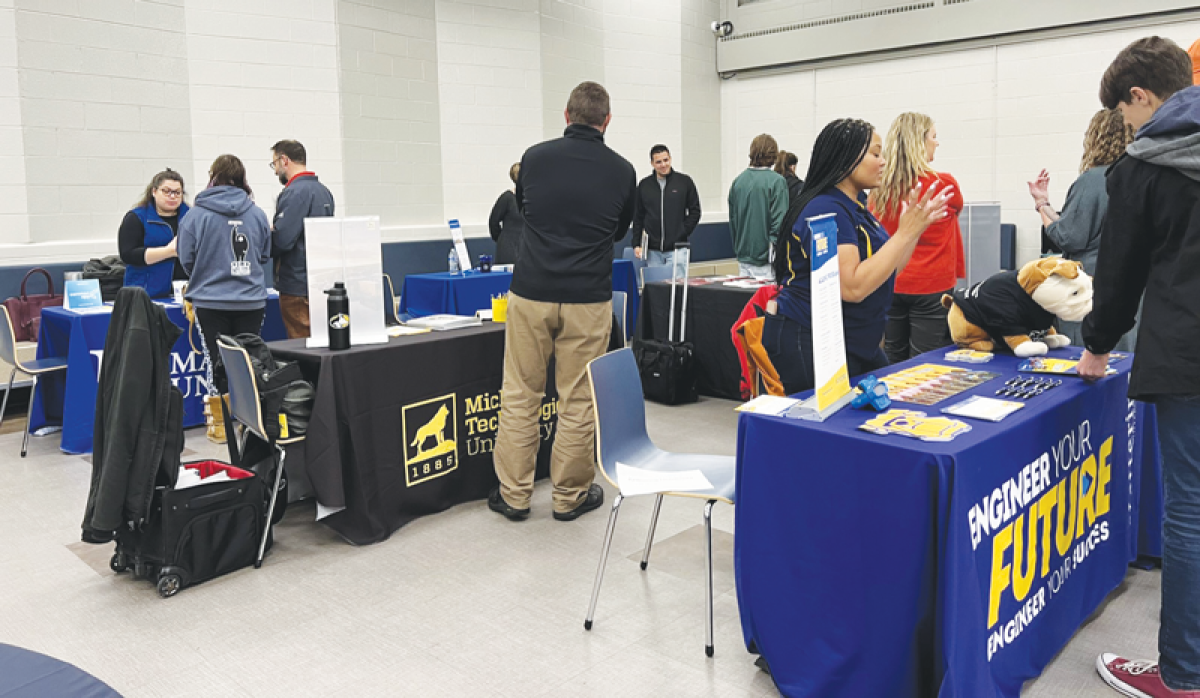  Berkley, Clawson and Royal Oak high schools are partnering to host a fair to help students chart their futures. The fair will include representatives from universities, colleges, businesses and trade schools. The schools previously held their fairs separately, as seen here at Clawson last year. 