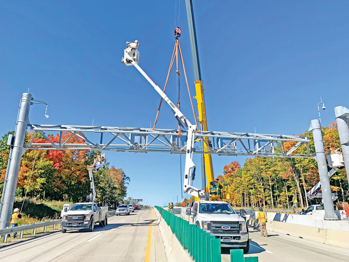  Crews work to reopen Interstate 96 near Beck Road in Novi after a gravel hauler struck a gantry and signage over the freeway Oct. 10. 