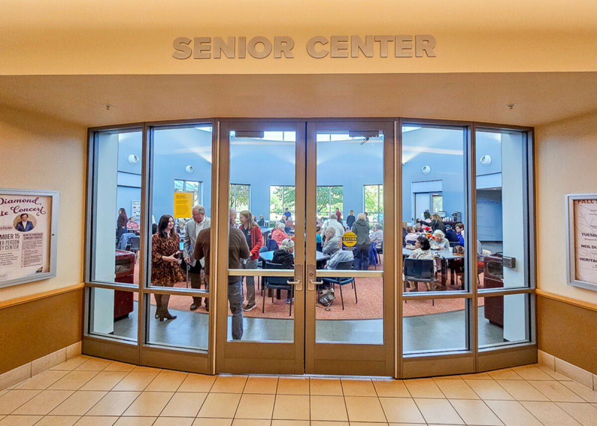  Guests enjoy the updated space for the grand opening of the Senior Center inside the Troy Community Center. 