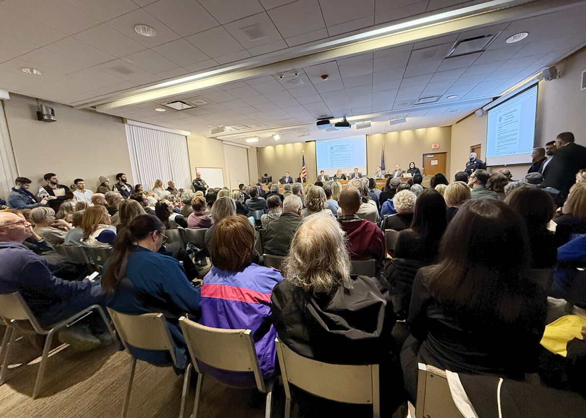  Bloomfield Township Board of Trustees member Stephanie Fakih makes a speech to a packed Bloomfield Township Town Hall auditorium Oct. 14 regarding a post she made on social media. 