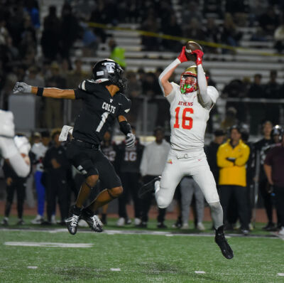  Troy Athens junior Nathan Piggott intercepts a pass for a 24-yard pick-six. 