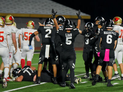  Troy celebrates a Noah Oury rushing touchdown. 