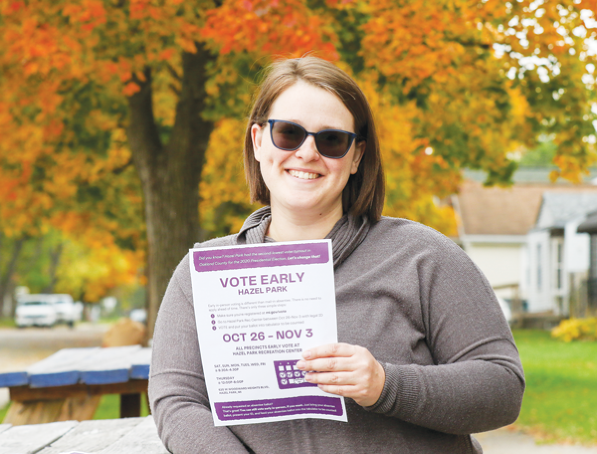  Kathryn Ellywicz, seen here at Hazel Perk Cafe Oct. 23, has been distributing yard signs and flyers raising awareness for early in-person voting at the Hazel Park Recreation Center. 