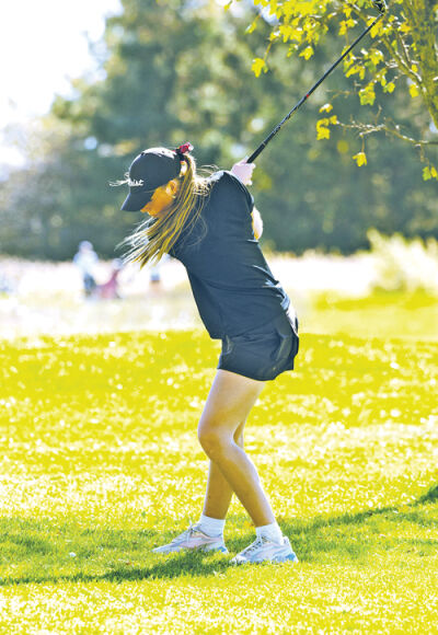  Mercy senior Emily Walker takes a swing during the Michigan High School Athletic Association Division 1 state finals. 