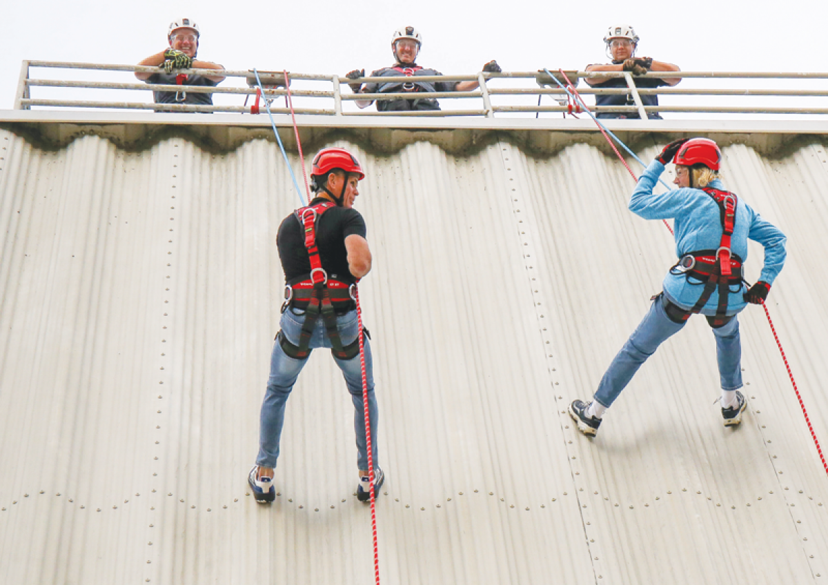  On Oct. 23, Macomb County Executive Mark Hackel, left, and state Rep. Denise Mentzer,  D-Mount Clemens, rappelled down the Macomb Community College’s live burn tower. 