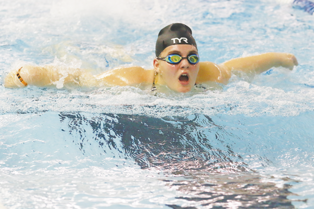   Warren Mott freshman Emmalyn Hinman competes in the 200-yard IM in a meet against Romeo and Harrison Township L’Anse Creuse High School Oct. 22 at L’Anse Creuse High School. 