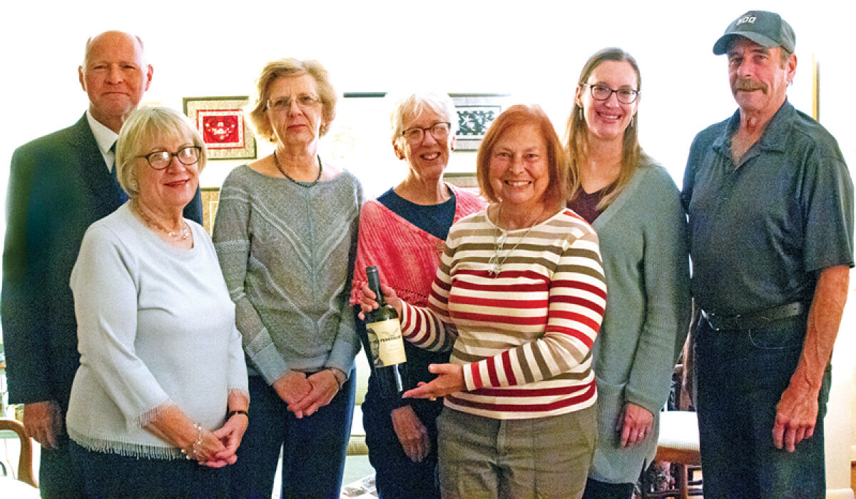  Presidential Book Club of Fraser members Kurt Schmidt, Carole Wiseman, Carol Pavlick, Karen Arendall, Pat Prisbe, Erica Foley and Jim Mischel pose for a photo. The members, who usually meet at the Fraser Public Library, met at Wiseman’s home for a special White House-themed meal Oct. 7. 