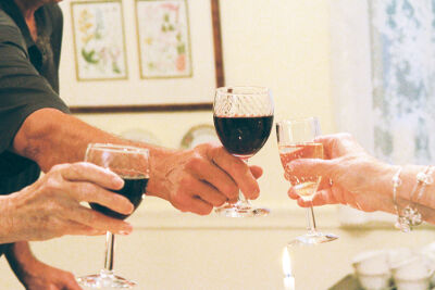  The Presidential Book Club of Fraser members begin their White House-themed meal with a toast. 