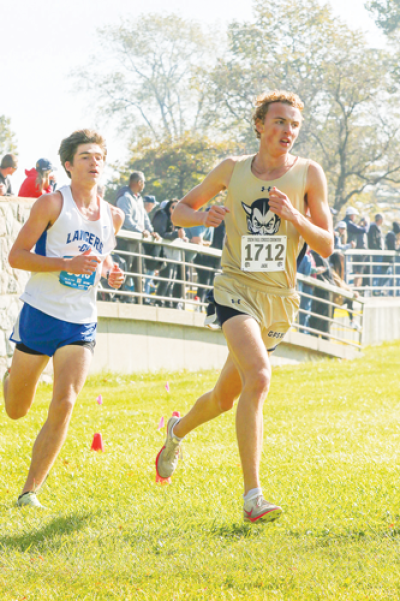  Grosse Pointe South senior Jack Martin, right, turns a corner during the Macomb Area Conference Division Championship Oct. 19 at Lake St. Clair Metropark. 