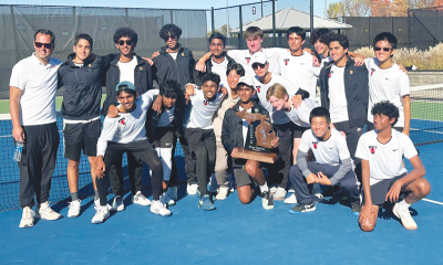  Troy celebrates its Division 1 state runner-up finish Oct. 19 at Byron Center West Sports Complex. 