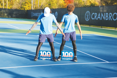  Detroit Country Day freshmen Ricky Jeong (3 singles) and Adam Mahmoud (4 singles) celebrate their state championship wins. 