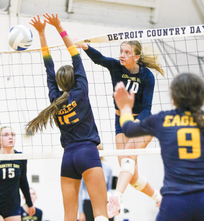  Detroit Country Day senior Olivia Grenadier sends a spike in a matchup against Hartland High School Oct. 24 at Country Day High School. 