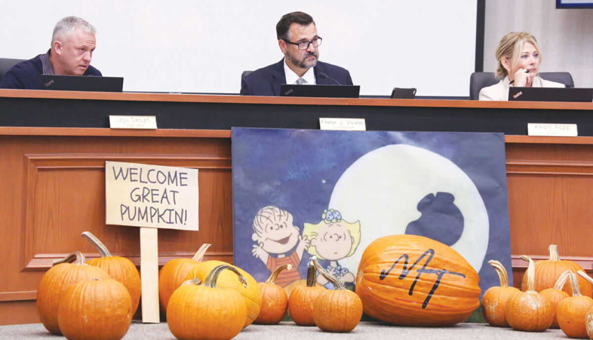  Macomb Township Treasurer Leon Drolet, Supervisor Frank Viviano and Clerk Kristi Pozzi listen to a speaker at the Oct. 23 Macomb Township Board of Trustees meeting. 