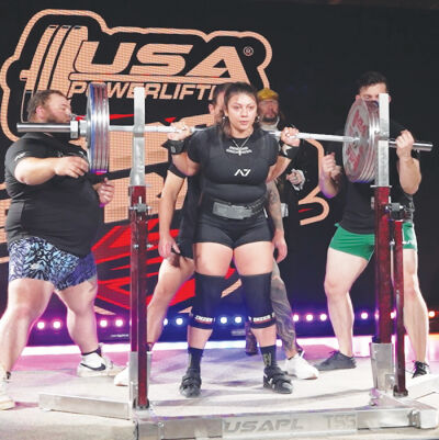  Troy resident Angela Kattula readies for a squat at the USA Powerlifting Raw Nationals Sept. 5 in Salt Lake City, Utah. 