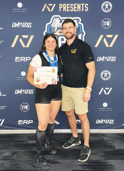  Angela Kattula and her trainer Brendan Papin celebrate her receiving her pro card after finishing top-3 in the USA Powerlifting Raw Nationals Sept. 5 in Salt Lake City, Utah. 