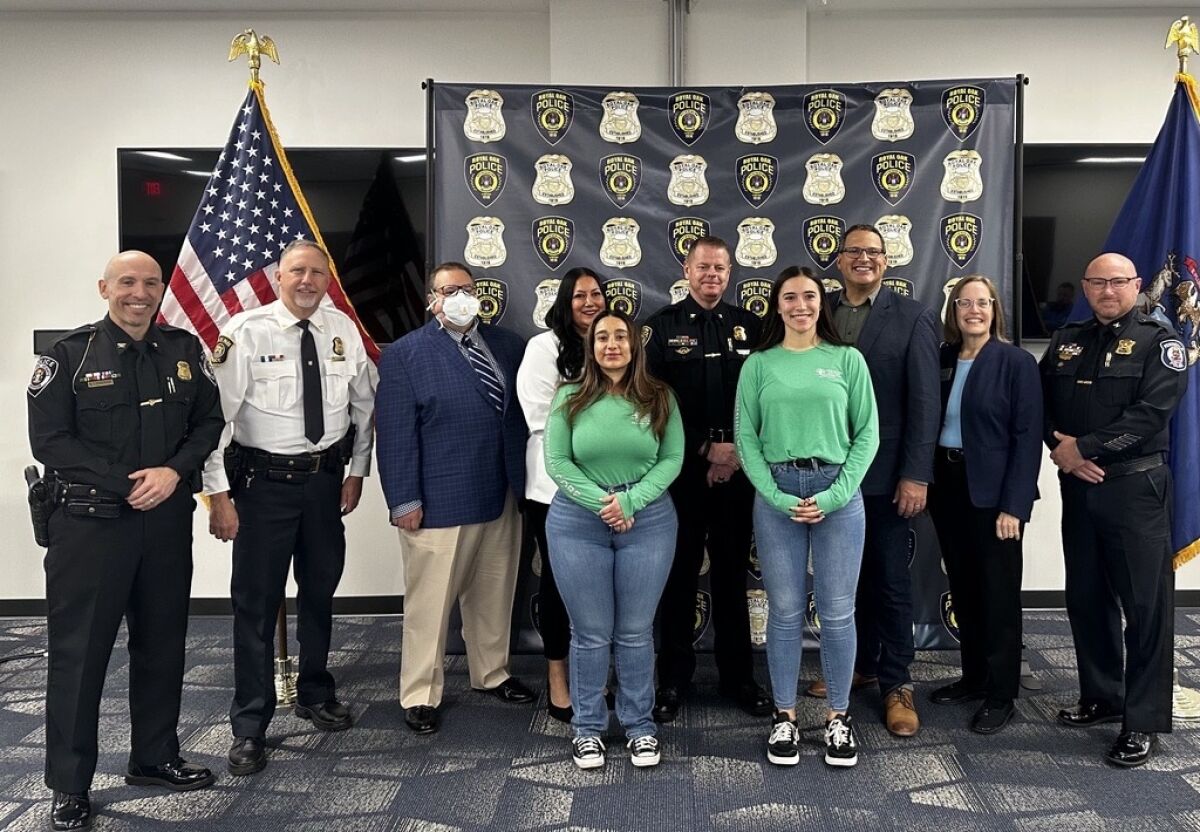  The co-responder program was officially launched Oct. 29 at a press conference held at the Royal Oak Police Department. CoRe is providing four communities with two clinicians tasked with assisting officers during mental health or substance abuse crises. Pictured, from left, in the back row: Chief Brent Lemerise, Madison Heights Police Department; Chief William Hamel, Hazel Park Police Department; Vasilis K. Pozios, M.D., chief medical officer, Oakland Community Health Network; Trisha Zizumbo, chief operating officer, OCHN; Chief Michael Moore, Royal Oak Police Department; Board Chair David T. Woodward, District 1, Oakland County Board of Commissioners; Ann Erickson Gault, District 3, Oakland County Board of Commissioners; and Chief Dennis Emmi, Ferndale Police Department. From left in the front row are Sabrina Fallone, co-responder, OCHN; and Alyssa Waters, co-responder, OCHN. 