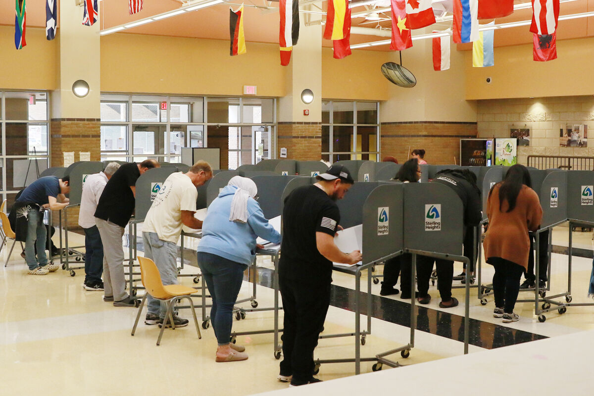  Voters fill out their ballots on Nov. 5, Election Day, at Sterling Heights High School in Sterling Heights. 