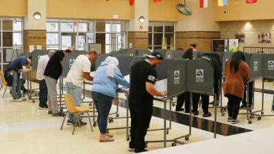  Voters fill out their ballots on Nov. 5, Election Day, at Sterling Heights High School in Sterling Heights. 