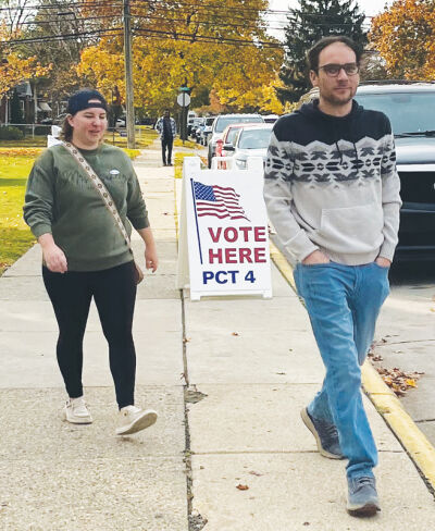  After casting their votes, Sam and Tony Scheer leave Precinct No. 4 in Eastpointe on Election Day Nov. 5.  