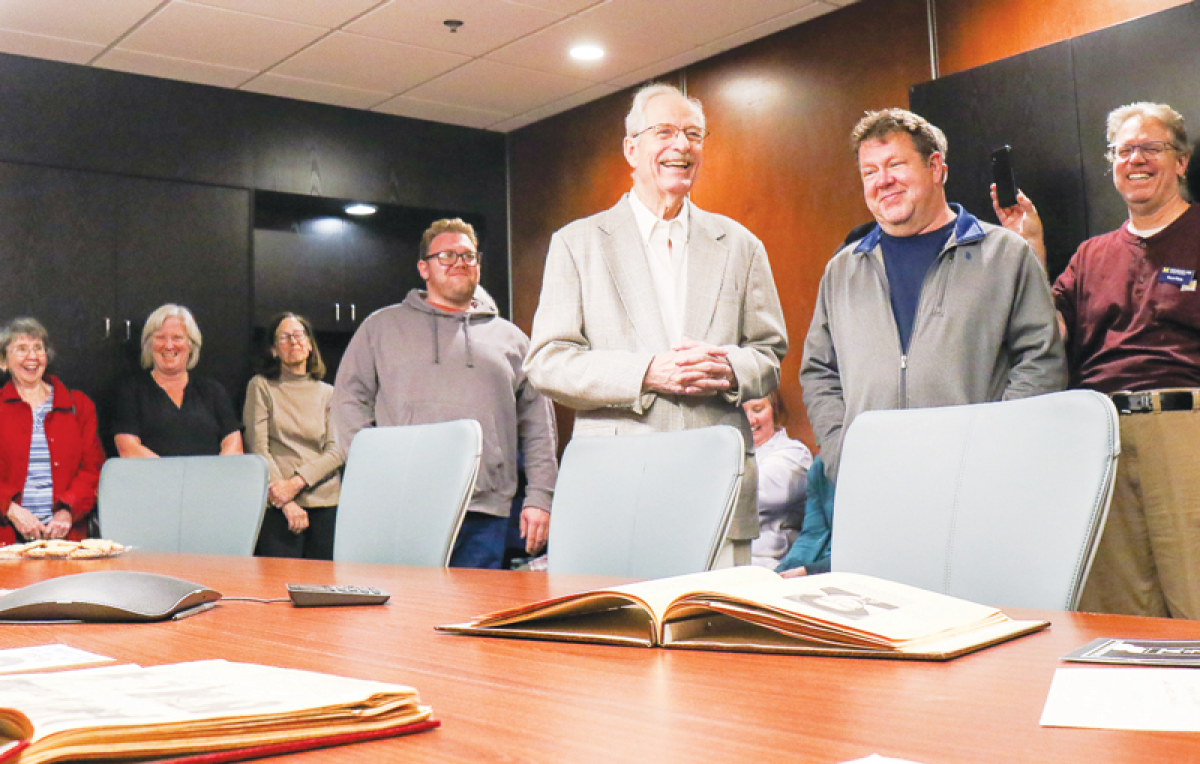  Lindell “Lin” Ross, middle, a former council member for Madison Heights, was honored at City Hall Oct. 28 in the executive conference room, which has been renamed after him.  