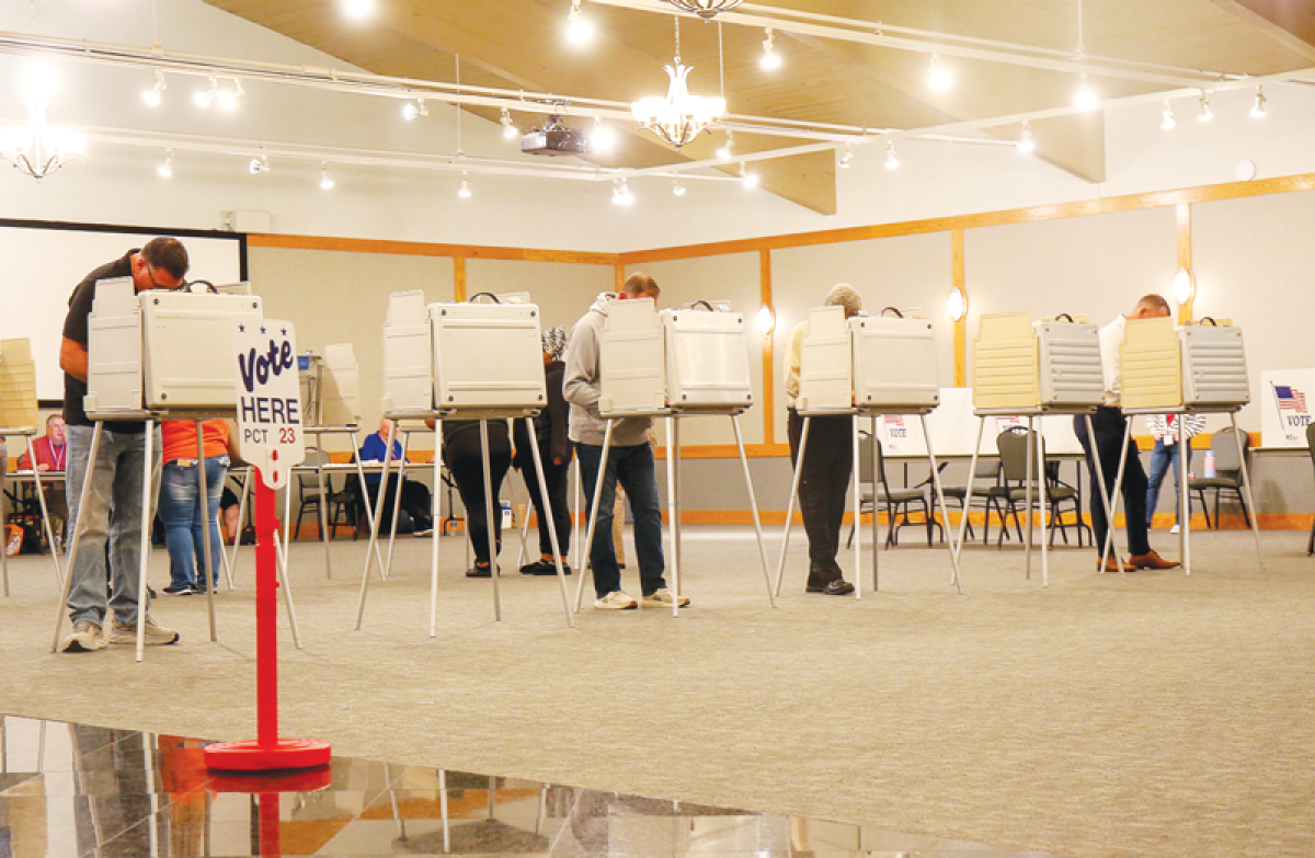  Voters cast their votes at St. John Vianney. Catholic Church in Shelby Township Nov. 5. 