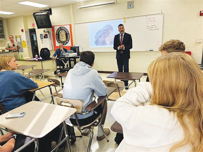  Through a partnership between Utica Community Schools and Shelby Township, officer James Knobelsdorf is leading a yearlong career and technical education course on law enforcement. 