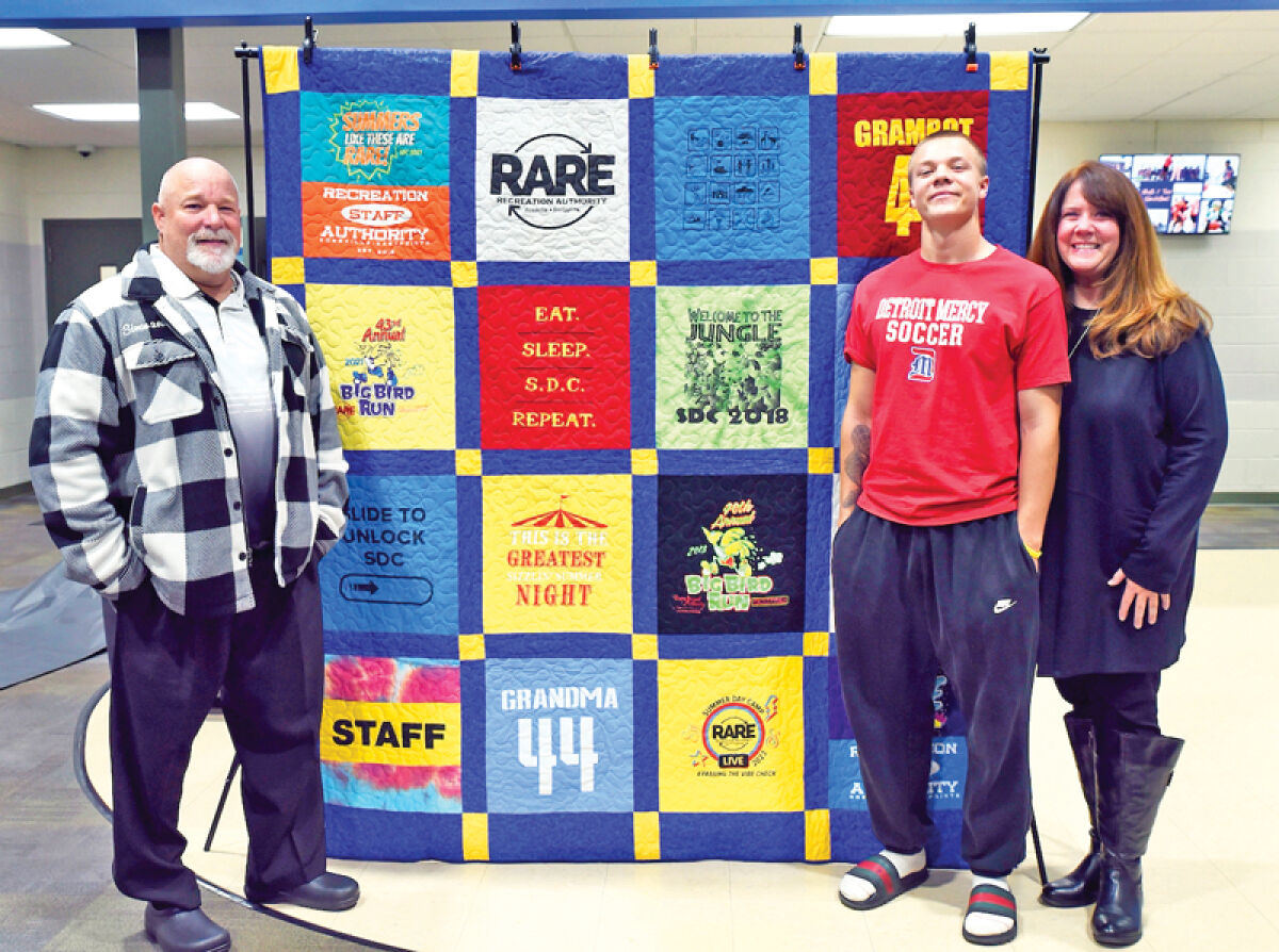  A quilt, made from their son Connor McMahon’s summer camp T-shirts, was presented Nov. 7 to Kathleen and Corey McMahon and their son Carter McMahon. Connor McMahon was killed in a hit-and-run car crash June 13, 2023, in Harper Woods. 