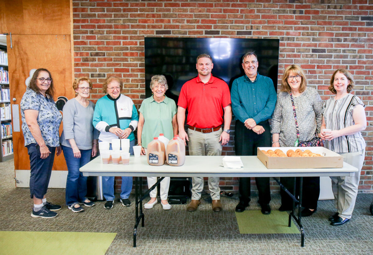  On Oct. 21, David Bruckelmeyer, engineering and entitlements manager for Sheetz, fourth from right, stopped by to see the Eastpointe Memorial Library’s new aquarium. Sheetz was one of the donors of the new aquarium. 