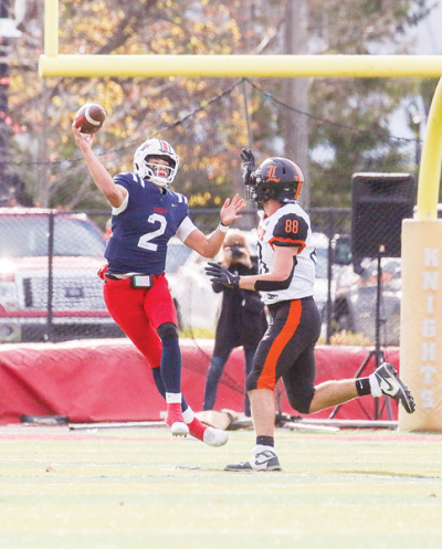  Grosse Pointe Woods University Liggett junior quarterback Nikkos Davis fires a pass on the run. 