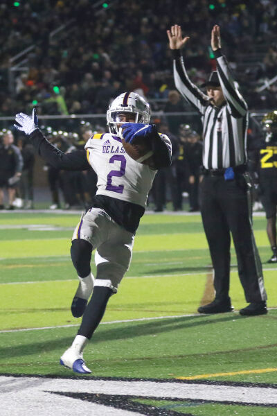  Warren De La Salle junior Damion King IV celebrates a touchdown reception. 